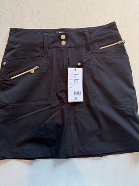 Daily Sports Black Skort with Gold Zipper Accents. NEW WITH TAG